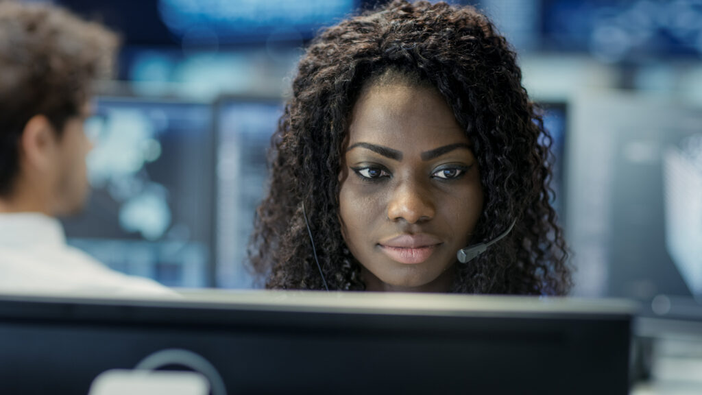 Live video monitoring operator reviewing security camera alerts